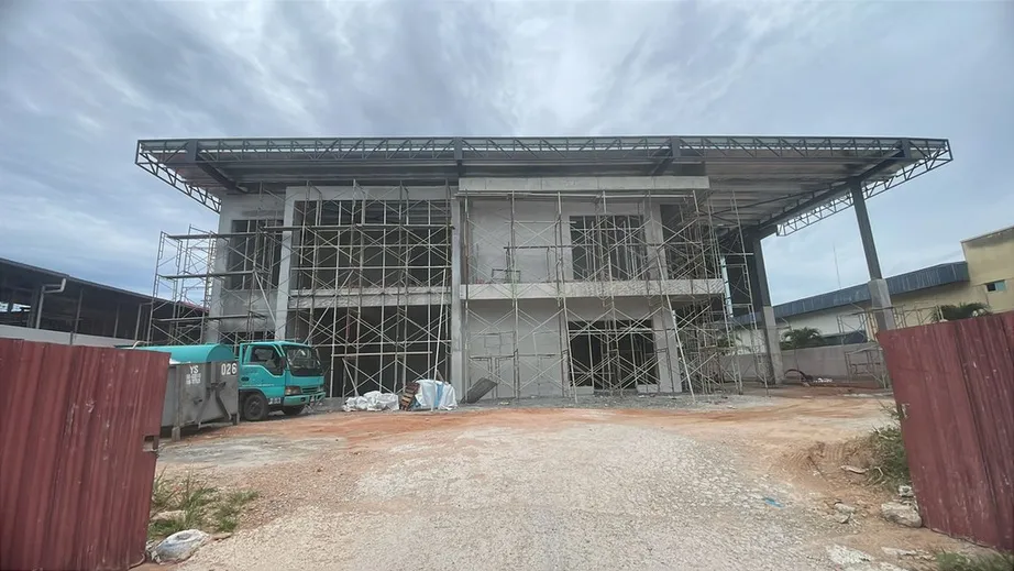 Steel-framed factory under construction with scaffolding in place, Johor Bahru