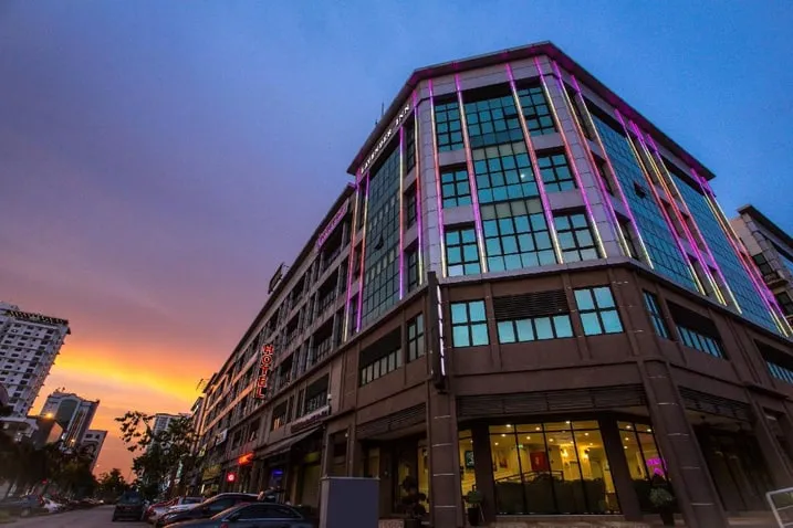 Corner elevation of Lavender Inn, USJ, photographed from street level at dusk