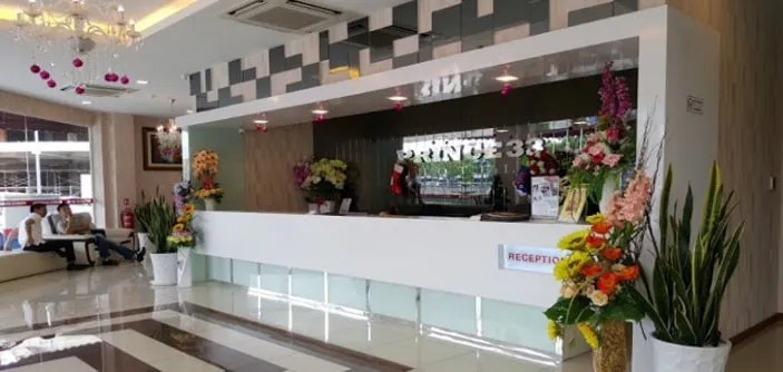 Reception counter and polished tiled lobby at Princess 33 Hotel, Taman Mount Austin